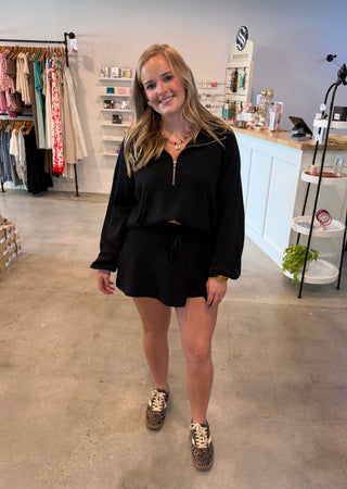 Woman in a black matching outfit 