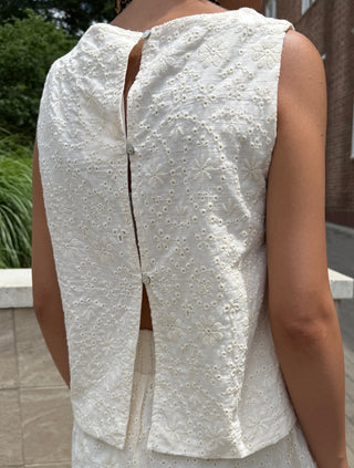 Person wearing a cream textured top