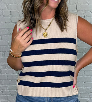 Sleeveless knit top with navy and taupe horizontal stripes.