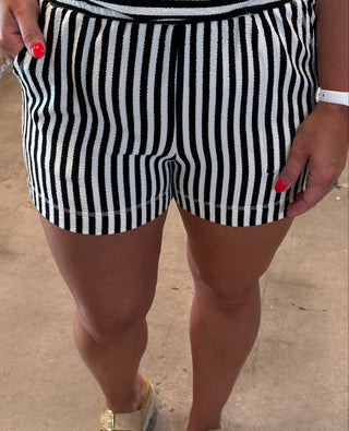 women wearing black and white striped shorts with pockets