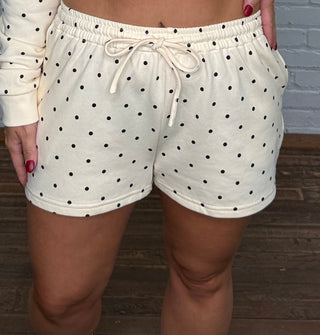 Cream with black polka dots hoodie and shorts matching set. Shorts have pockets and drawstring.
