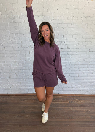 Women wearing a casual matching set paired with butter yellow tennis shoes.