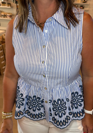 blue and white striped peplum top with floral patterns 