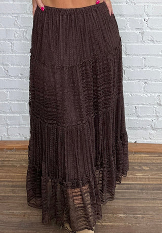 Dark brown tiered lace midi skirt, paired with beige ankle boots.