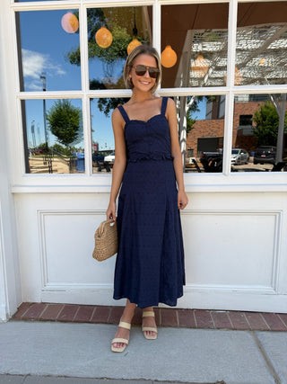Navy blue eyelet matching skirt and top set.