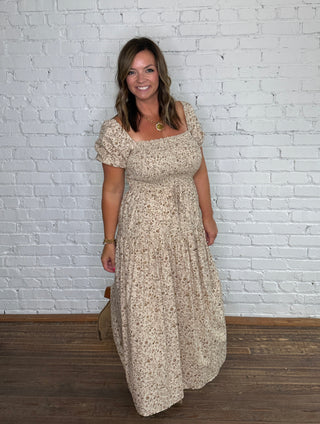 Beige, tan and white floral print midi dress with puff sleeves.