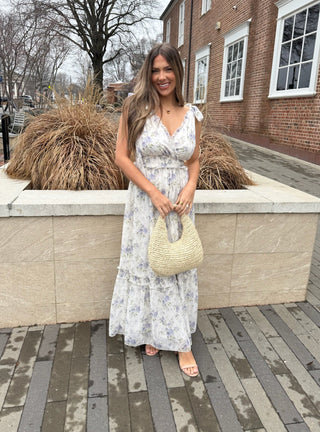 White Midi dress featuring a blue floral print and adjustable shoulder ties